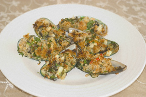 Crumbed mussels on a plate