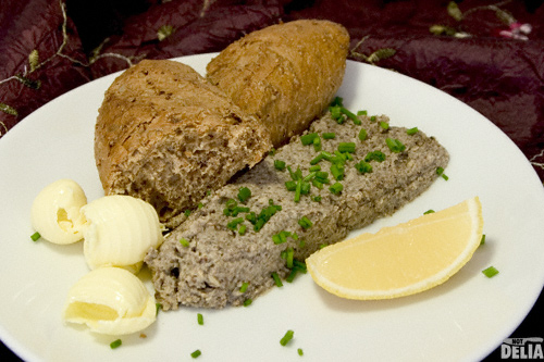 Not Delia's mushroom and hazelnut pate Mushroom and hazelnut pate on a plate with wholemeal bread, curls of butter and a wedge of lemon