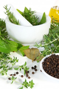 Culinary herbs, a pestle and mortar