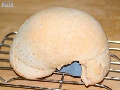 Is it a snail? Is it an armadillo? Is it a skull in profile? No, it's Mr Not Delia's loaf of white bread A small, oddly shaped loaf of bread-making machine bread