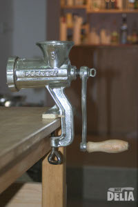 The Porkert No.8 Mincer assembled and clamped to a work table