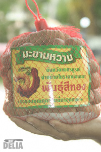 Thai sweet tamarind pods in a net