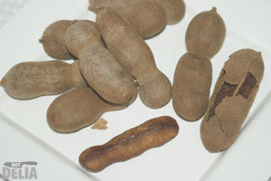 A plate of sweet tamarind pods - ma kham wan in Thai A plate of sweet tamarind - ma kham wan in Thai