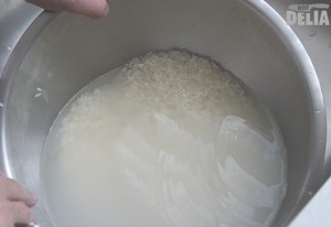 Rice in the washing process, in starchy water