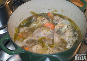 Chicken casserole cooking in a cast-iron pot
