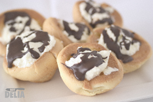 Not-for-profiteroles - choux pastry shells filled with cream and topped with chocolate sauce