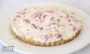 Strawberry & white chocolate cheesecake on a plate
