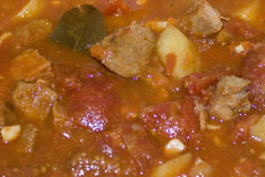 Goulash soup - stewing steak, potatoes, onion and carrot in a rich tomato and bayleaf liquor
