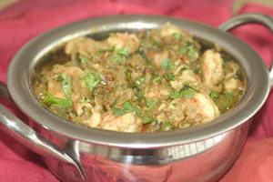 Prawn pathia in a steel presentation karahi