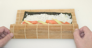 A nori roll (makizushi) in the first stage of being rolled