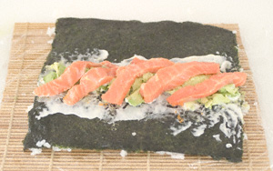Nori sheet on a makisu and spread with a little wasabi and a more generous spread of mayonnaise