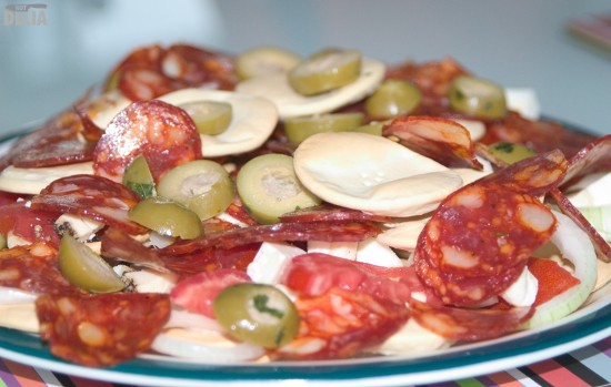 Gozitan snacks - olives, salami, cheese - arranged on a plate