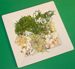 Prepared ingredients for Thai green curry on a plate