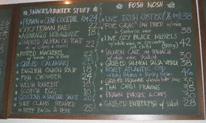 Blackboard with a food menu written in coloured chalks