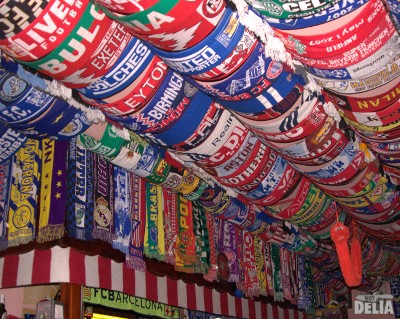 Football scarves on a bar ceiling