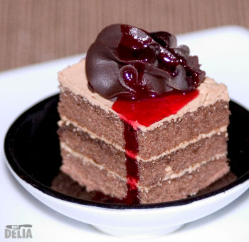 A chocolate sponge dessert with a sticky jam-like sauce