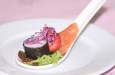Smoked salmon and maki roll presented on a Chinese soup spoon