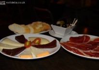 A selection of Manchego cheese, Tapa Negra ham, bread and olives from the Tapas Cafe in Bangkok