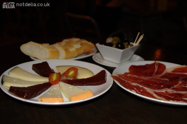 A selection of Manchego cheese, Tapa Negra ham, bread and olives from the Tapas Cafe in Bangkok