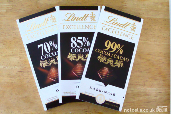 Three bars of Lindt Excellence chocolate: 70%, 85% and 99%